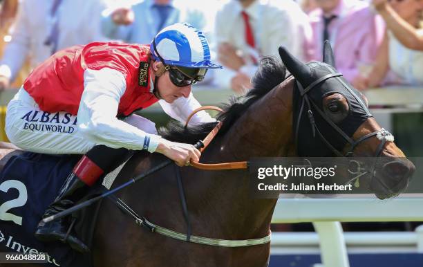 Adam Kirby riding Connect wins The Investec Private Banking Handicap Stakes Race run during Investec Derby Day at Epsom Downs Racecourse on June 2,...