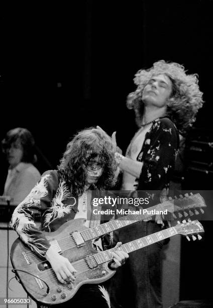 Guitarist Jimmy Page plays a double-necked guitar during a concert by English rock group Led Zeppelin at Earls Court Arena in London, May 1975....