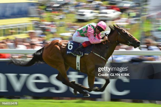 Jockey Frankie Dettori cruises to victory on Wilamina in the Princess Elizabeth Stakes on the second day of the Epsom Derby Festival in Surrey,...