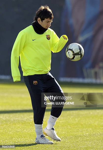 Barcelona's Argentinian forward Lionel Messi controls a ball during a training session at Ciutat Esportiva Joan Gamper in Barcelona on February 11,...