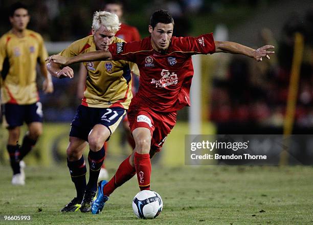 Mathew Leckie of Adelaide competes with Scott Balderson of the Jets during the round 27 A-League match between the Newcastle Jets and Adelaide United...