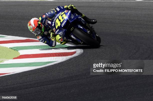 Movistar Yamaha MotoGP's Italian rider Valentino Rossi takes a bend during a Moto GP qualifying session in the Italian Grand Prix at the Mugello...