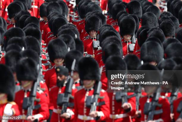 Guard divisions make their way down The Mall after taking part in the Colonel's Review, the final rehearsal of the Trooping the Colour, the Queen's...