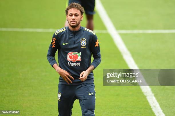 Brazil's striker Neymar takes part in a training session at Anfield stadium in Liverpool on June 2 ahead their International friendly football match...