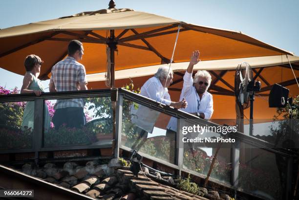 Leader Beppe Grillo shows a small silver bell as he overlooks by the terrace of the Forum Hotel in Rome, on 2 June 1946. On June 2, 2018 in Rome,...