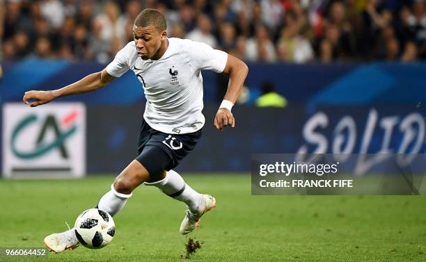 France's forward Kylian Mbappe controls the ball during the friendly football match between France and Italy at the Allianz Riviera stadium in Nice,...