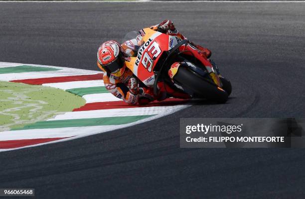 Repsol Honda's Spanish rider Marc Marquez takes a bend during a Moto GP qualifying session in the Italian Grand Prix at the Mugello track on June 2,...