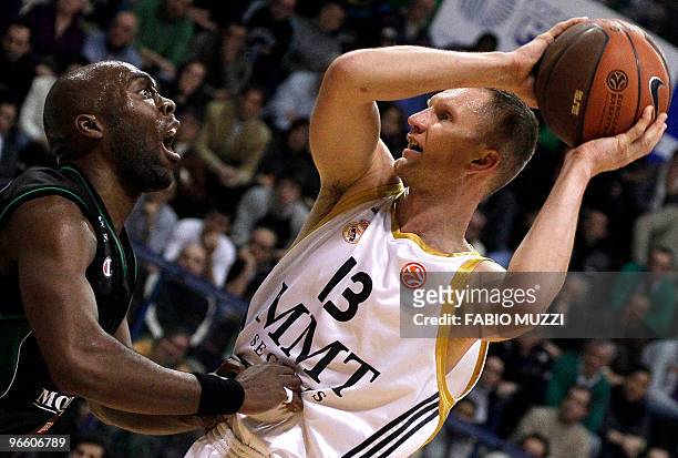 Montepaschi's Siena Romain Sato tries to get the ball from Real Madrid's Rimantas Kaukenas during their Top 16 Game 3, Groupe E, Euroleague...