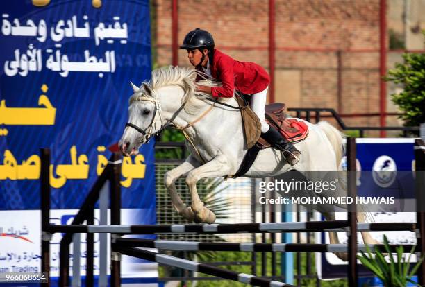 Yemeni youth competes in the National Horse Jumping Championships in the capital Sanaa on June 1, 2018. - With rebel fighters on the ground and...