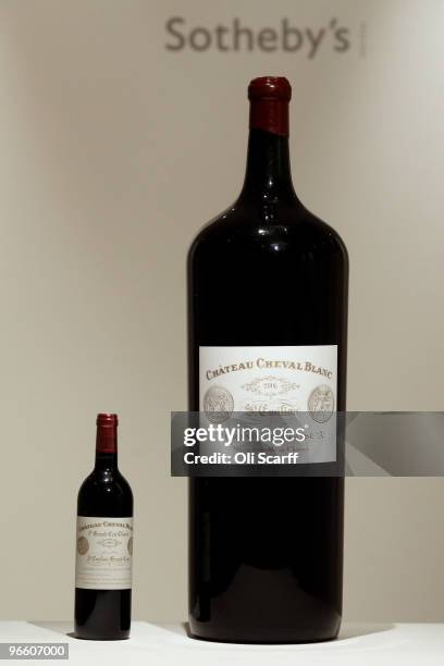 Melchior of Chateau Cheval Blanc 2006 is pictured alongside a standard sized bottle in Sotheby's auction house on February 12, 2010 in London,...