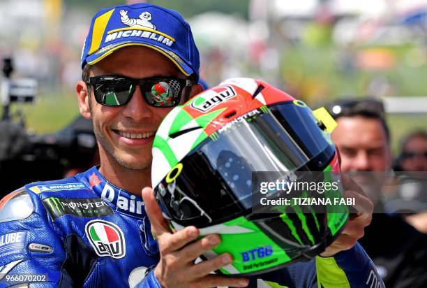 Italian Movistar Yamaha rider Valentino Rossi celebrates his pole position after the Moto GP qualifying session of the Italian Grand Prix at the...