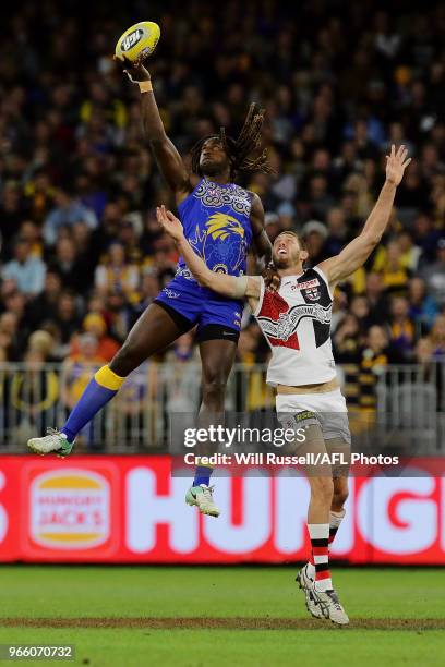 Nic Naitanui of the Eagles contests a ruck with Tom Hickey of the Saints during the round 11 AFL match between the West Coast Eagles and the St Kilda...