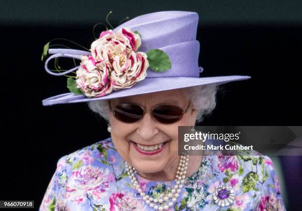 Queen Elizabeth II watches the racing at the Epsom Derby Festival at Epsom Racecourse on June 2, 2018 in Epsom, England.