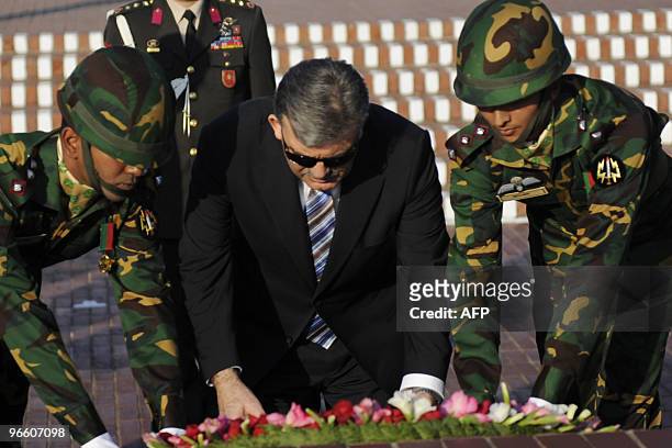 Turkish President Abdullah Gul lays a floral wreath at the National Martyrs' Memorial of Bangladesh at Savar, some 30 km from Dhaka, on February 12,...