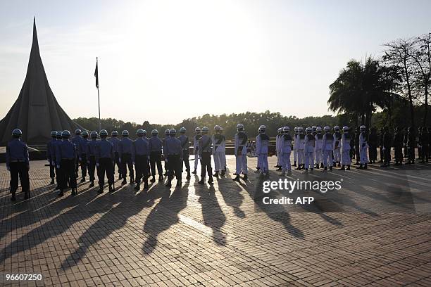 Bangladeshi military guard of honour stand in formation as they wait for Turkish President Abdullah Gul to arrive at the National Martyrs' Memorial...