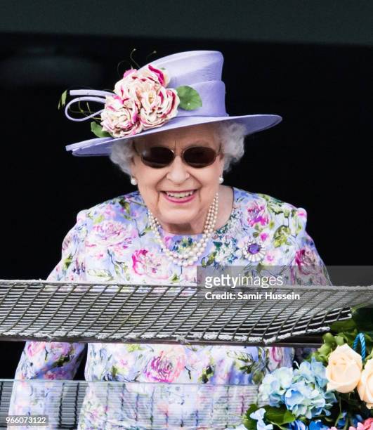 Queen Elizabeth II watches the racing as she attends the Epsom Derby at Epsom Racecourse on June 2, 2018 in Epsom, England.