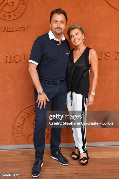 Henri Leconte and Maria Dowlatshahi attend the 2018 French Open - Day Seven at Roland Garros on June 2, 2018 in Paris, France.