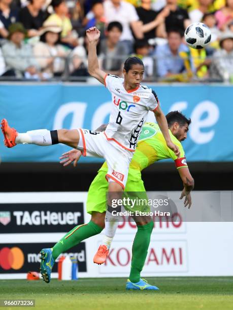 Takayuki Mae of Renofa Yamaguchi and Joaquin Larrivey of JEF United Chiba compete for the ball during the J.League J2 match between JEF United Chiba...