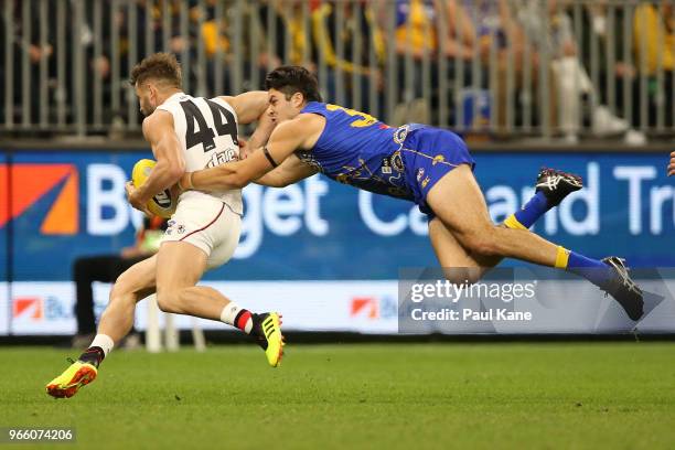 Tom Barrass of the Eagles tackles Maverick Weller of the Saints during the round 11 AFL match between the West Coast Eagles and the St Kilda Saints...