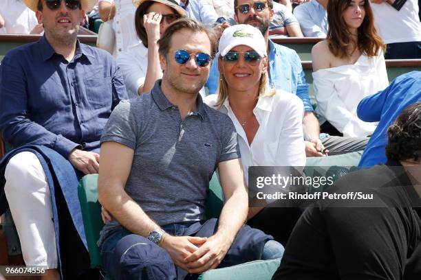 Violonist Renaud Capucon and his wife journalist Laurence Ferrari attend the 2018 French Open - Day Seven at Roland Garros on June 2, 2018 in Paris,...