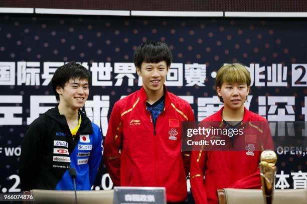 Lin Gaoyuan of China and Chen Xingtong of China attend the press conference after winning the Mixed Doubles final match against Ito Mima of Japan and...