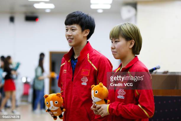 Lin Gaoyuan of China and Chen Xingtong of China attend the press conference after winning the Mixed Doubles final match against Ito Mima of Japan and...
