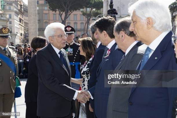 President of Italy Sergio Mattarella shakes hands with Italian Prime Minister Giuseppe Conte during the ceremony to mark the anniversary of the...