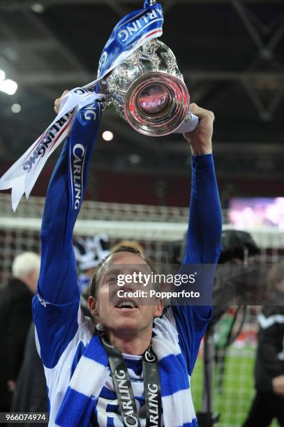 Lee Bowyer of Birmingham City lifts the trophy in celebration after his team win the Carling Cup Final between Arsenal and Birmingham City at Wembley...