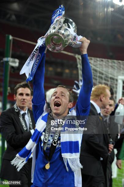 Lee Bowyer of Birmingham City lifts the trophy in celebration after his team win the Carling Cup Final between Arsenal and Birmingham City at Wembley...