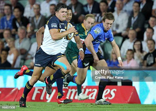 Adam Ashley-Cooper of the Brumbies makes a break down the wing during the round one Super 14 match between the Western Force and the Brumbies at ME...