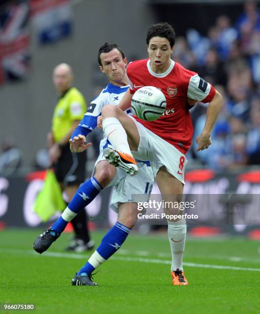 Samir Nasri of Arsenal is chased by Keith Fahey of Birmingham City during the Carling Cup Final between Arsenal and Birmingham City at Wembley...