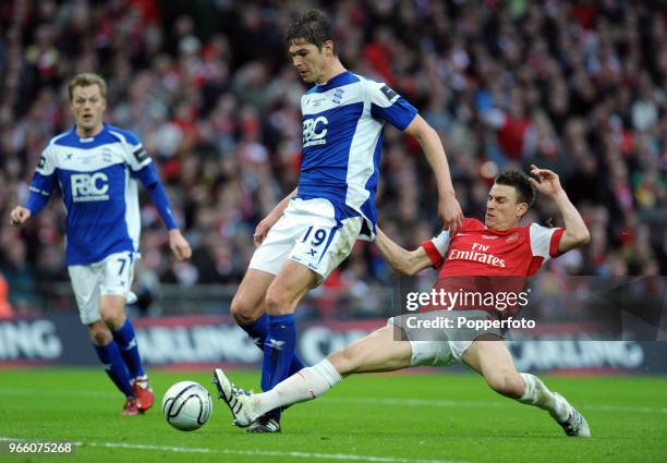 Nikola Zigic of Birmingham City is tackled by Laurent Koscielny of Arsenal during the Carling Cup Final between Arsenal and Birmingham City at...