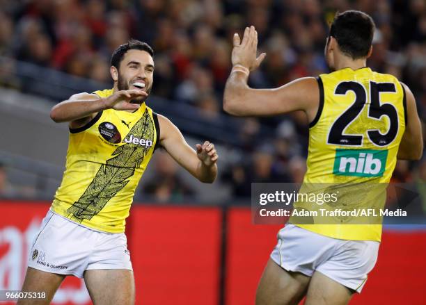 Shane Edwards of the Tigers celebrates a goal with Toby Nankervis of the Tigers during the 2018 AFL round 11 Dreamtime at the G match between the...