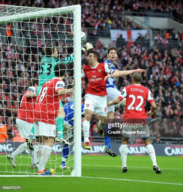 Nikola Zigic of Birmingham City scores a goal past goalkeeper Wojciech Szczesny and Robin van Persie of Arsenal during the Carling Cup Final between...