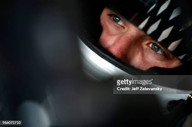 Alex Bowman, driver of the Nationwide Chevrolet, sits in his car during practice for the Monster Energy NASCAR Cup Series Pocono 400 at Pocono...