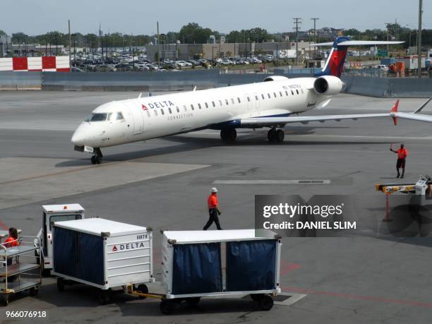 Delta Airlines jet pulls up to a gate at at MontréalPierre Elliott Trudeau International Airport on June 1, 2018.