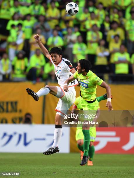 Keita Yamashita of Renofa Yamaguchi and Andrew kumagai of JEF United Chiba compete for the ball during the J.League J2 match between JEF United Chiba...