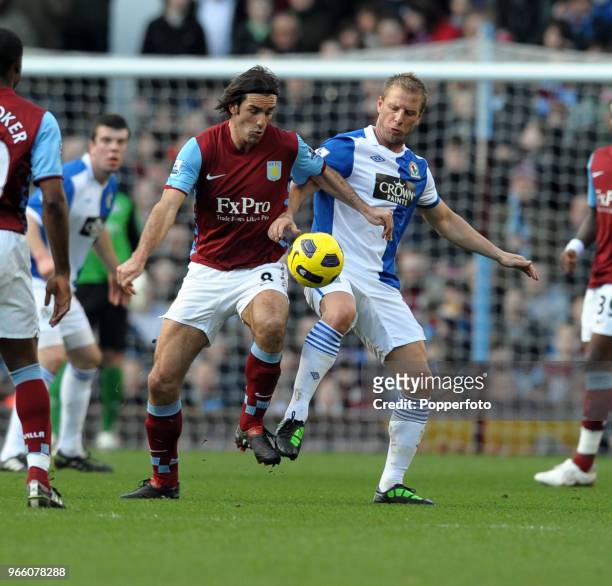 Robert Pires of Aston Villa battles with Vince Grella of Blackburn Rovers during the Barclays Premier League match between Aston Villa and Blackburn...