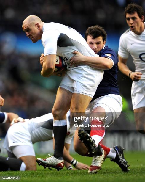 Mike Tindall of England is tackled by Thomas Domingo of France during the RBS Six Nations Championship match between England and France at Twickenham...