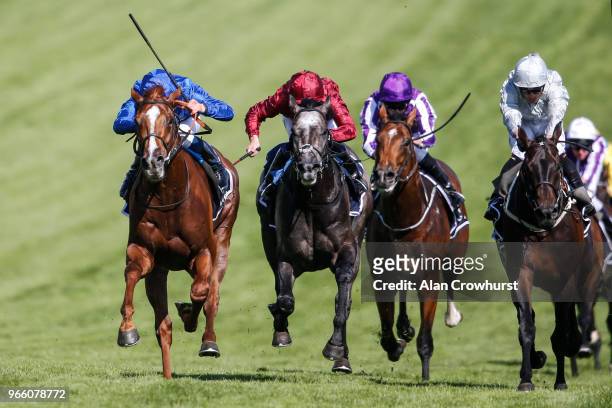 William Buick riding Masar win The Investec Derby from Dee Ex Bee during Investec Derby Day at Epsom Downs Racecourse on June 2, 2018 in Epsom,...