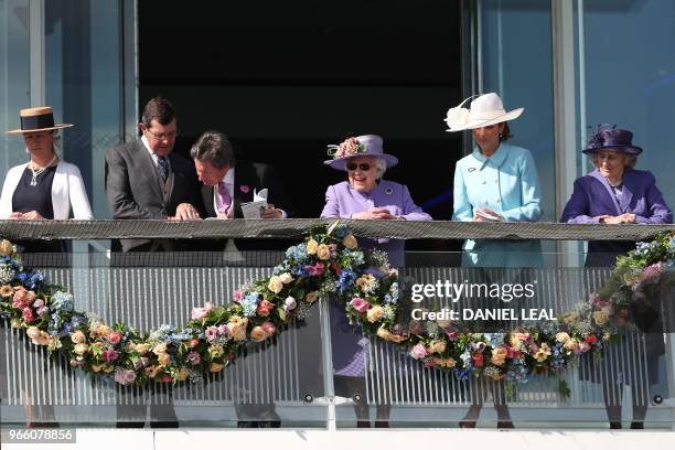 Britain's Queen Elizabeth II attends the second day of the Epsom Derby Festival in Surrey, southern England on June 2, 2017.