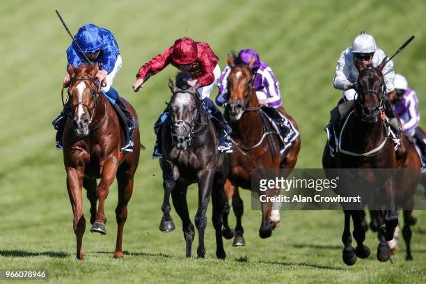 William Buick riding Masar win The Investec Derby from Dee Ex Bee during Investec Derby Day at Epsom Downs Racecourse on June 2, 2018 in Epsom,...