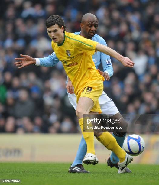 Patrick Vieira of Manchester City battles with Alan Gow of Notts County during the FA Cup 4th Round replay between Manchester City and Notts County...