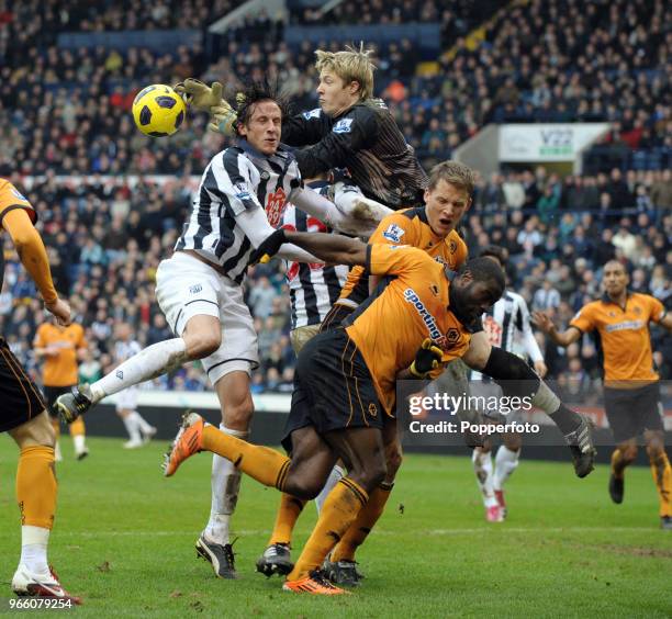 Clash between players Jonas Olsson of West Bromwich Albion, Wayne Hennessey, Christophe Berra and George Elokobi of Wolverhampton Wanderers during...