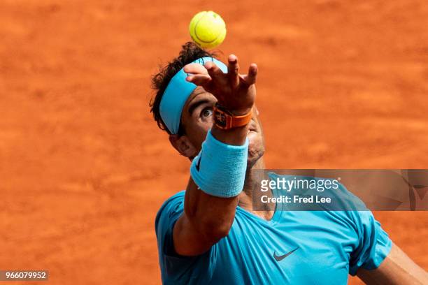 Rafael Nadal of Spain serves during his mens singles third round match against Richard Gasquet of France during day 7 of the 2018 French Open at...