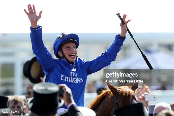 William Buick ridding Masar celebrates winning the Investec Derby race on Derby Day at Epsom Downs on June 2, 2018 in Epsom, England.