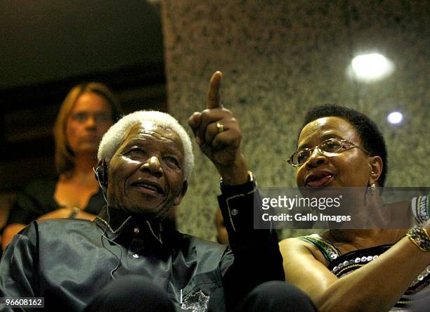 Former president Nelson Mandela with wife Graca Machel in Parliament for President Jacob Zuma's State of the Nation Address at the opening of...