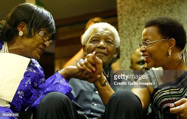 Former president Nelson Mandela with wife Graca Machel and ex-wife Winnie Mandela in Parliament for President Jacob Zuma's State of the Nation...