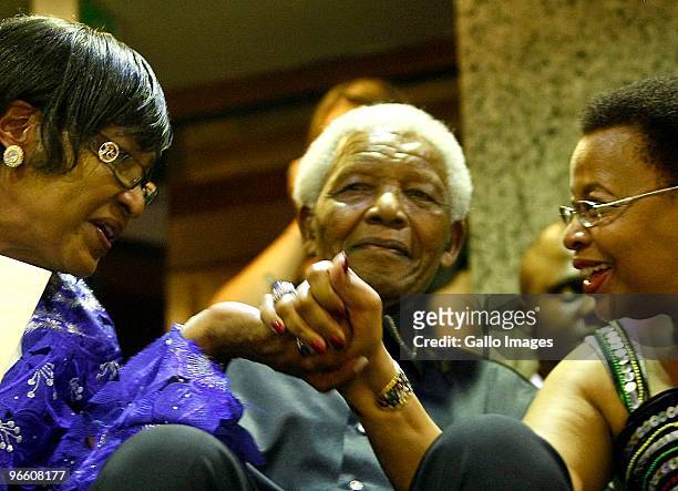 Former president Nelson Mandela with wife Graca Machel and ex-wife Winnie Mandela in Parliament for President Jacob Zuma's State of the Nation...