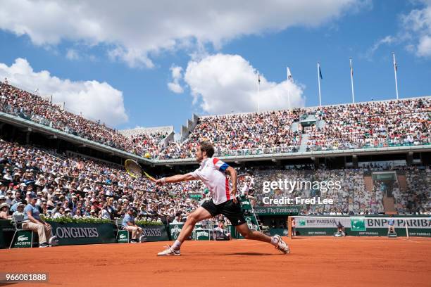 Richard Gasquet of France plays a backhand during his mens singles third round match against Rafael Nadal of Spain during day 7 of the 2018 French...